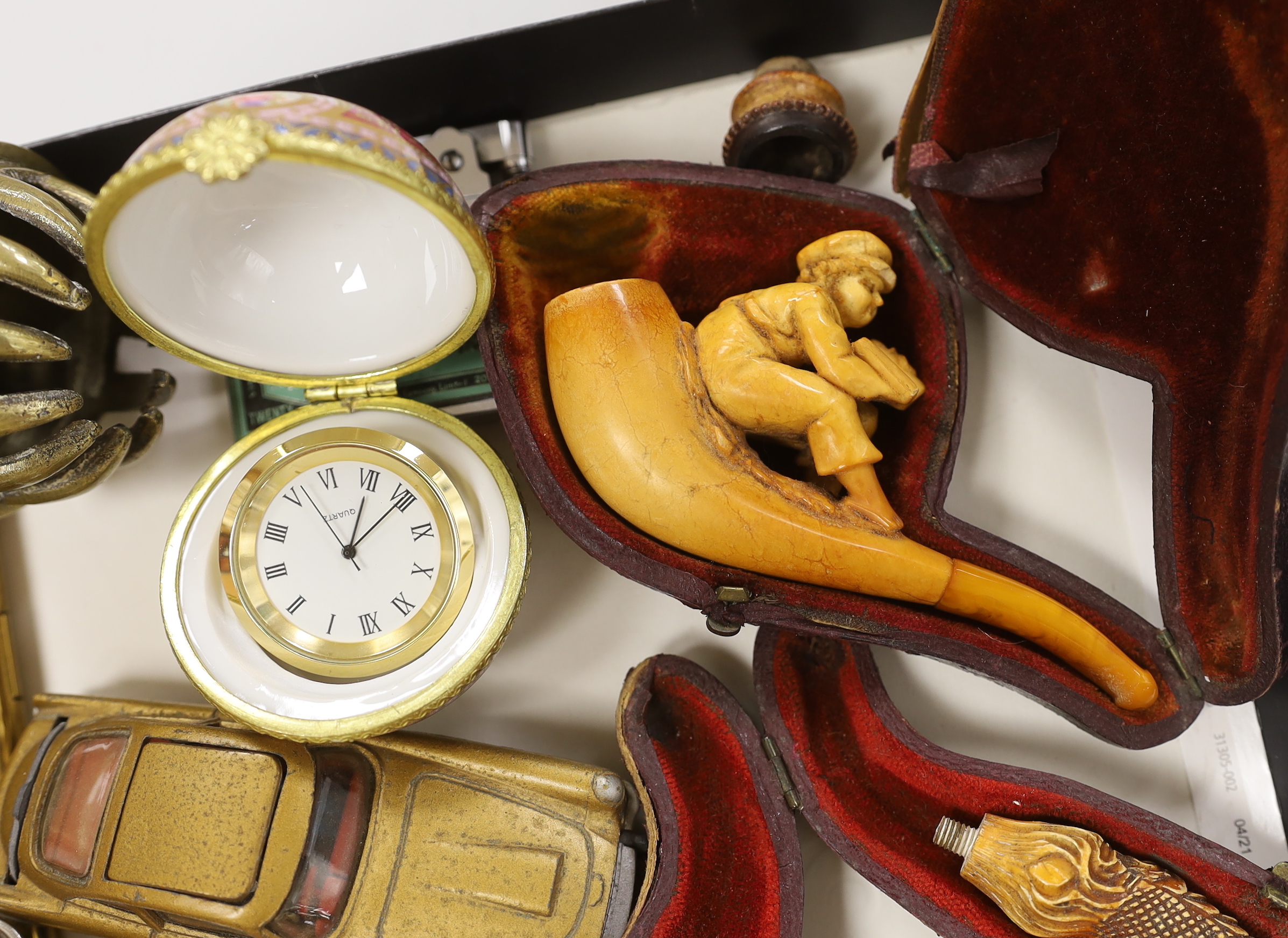 A group of mixed collectables including a Corgi James Bond Aston Martin DB, smoking pipes etc.